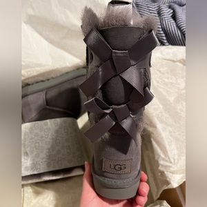 Grey, short, size 8 Ugg boots with the Bailey Bow style on the back